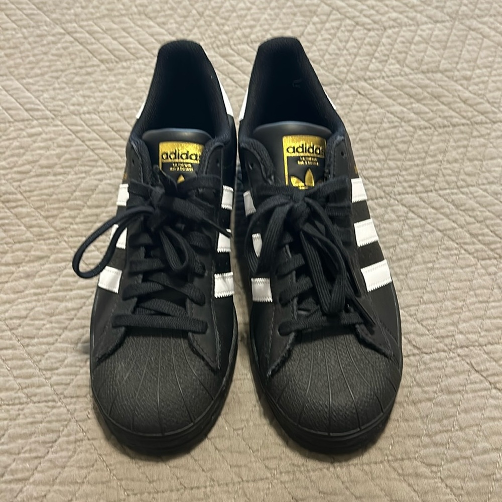 Adidas Superstar men’s sneakers. Size 7.5. Never worn.